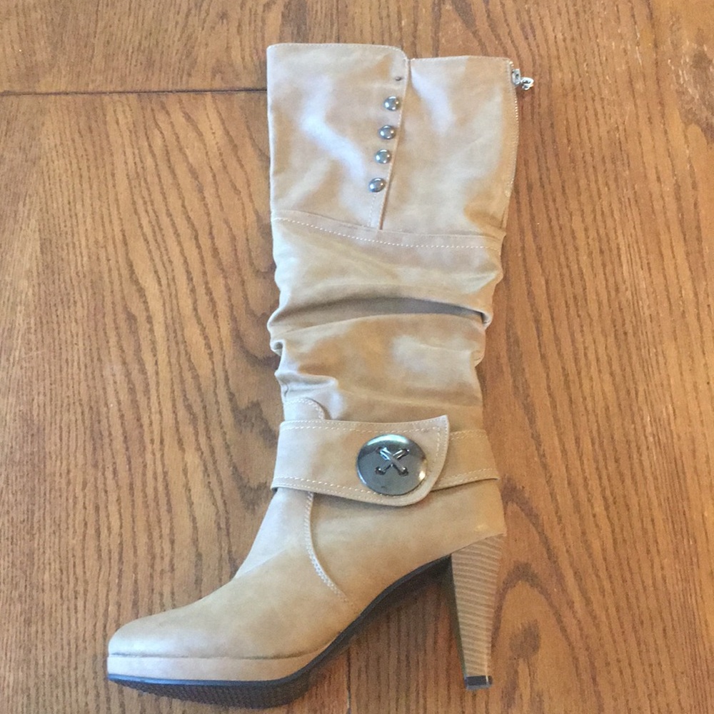 Tan heeled boots.